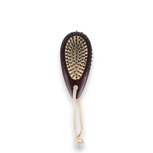 Said Salem Wessen dark brown wooden hair brush with metal pins and a hanging rope for daily detangling.