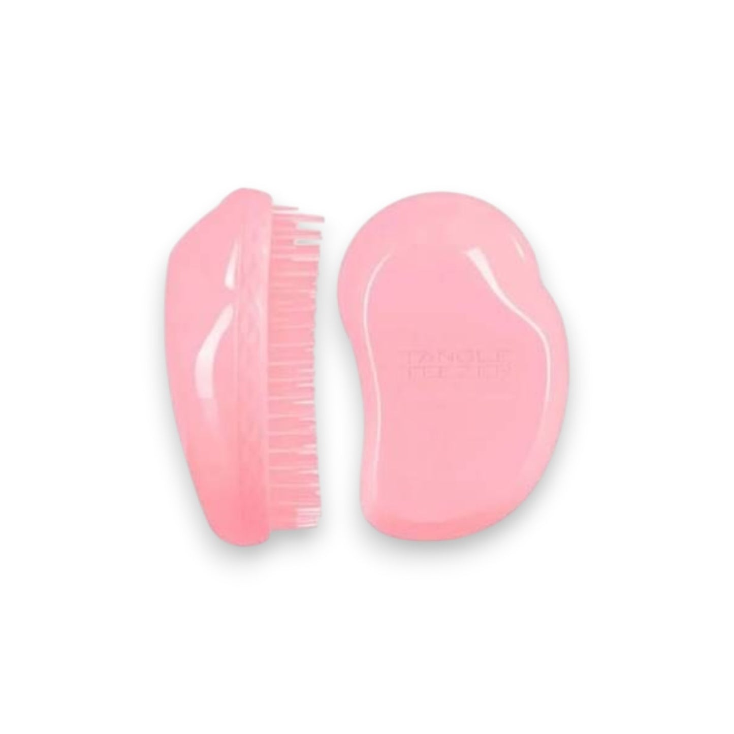 Said Salem Tangle Teezer Thick & Curly detangling hairbrush in vibrant pink with ergonomic palm-friendly design.