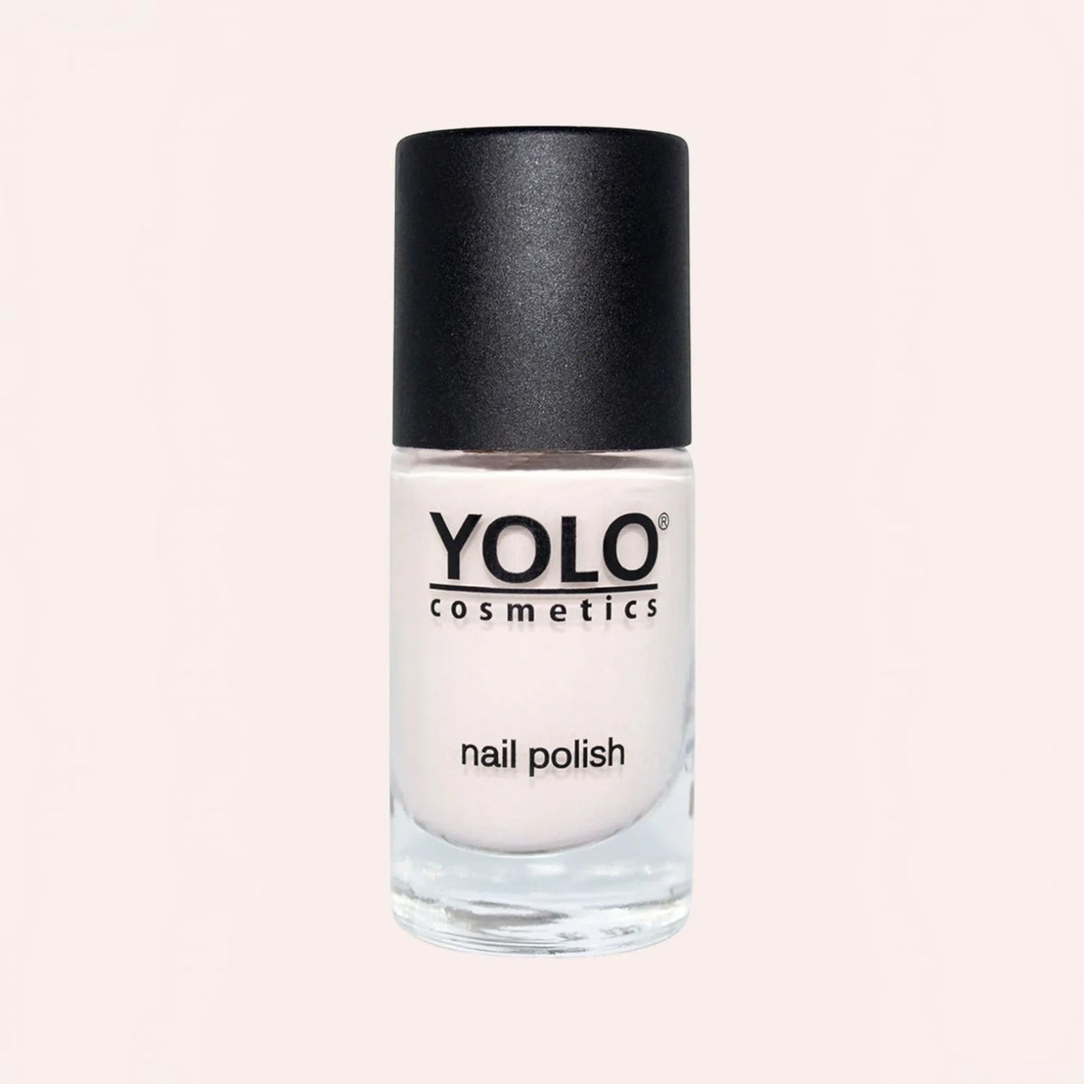 Said Salem YOLO Beige nail polish in a clear glass bottle with a black cap, featuring a neutral creamy beige shade.