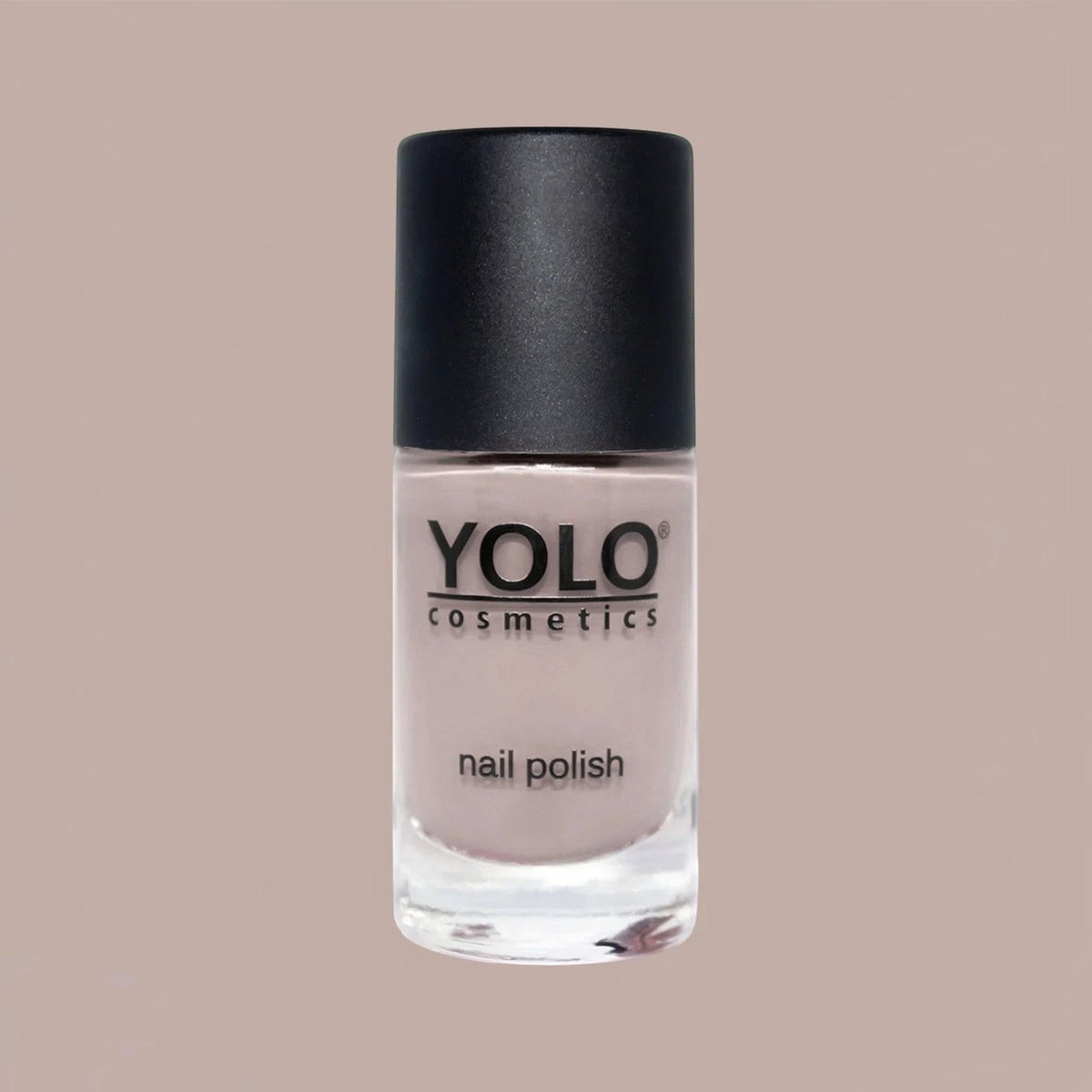 Said Salem YOLO Beige nail polish in a clear glass bottle with a black cap, featuring a neutral, creamy beige shade.