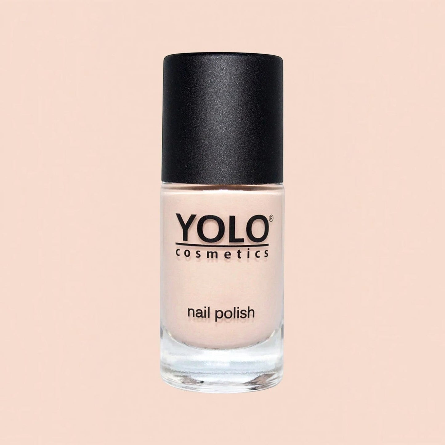 Said Salem YOLO Beige nail polish in a clear glass bottle with a black cap, featuring a neutral, creamy beige shade.