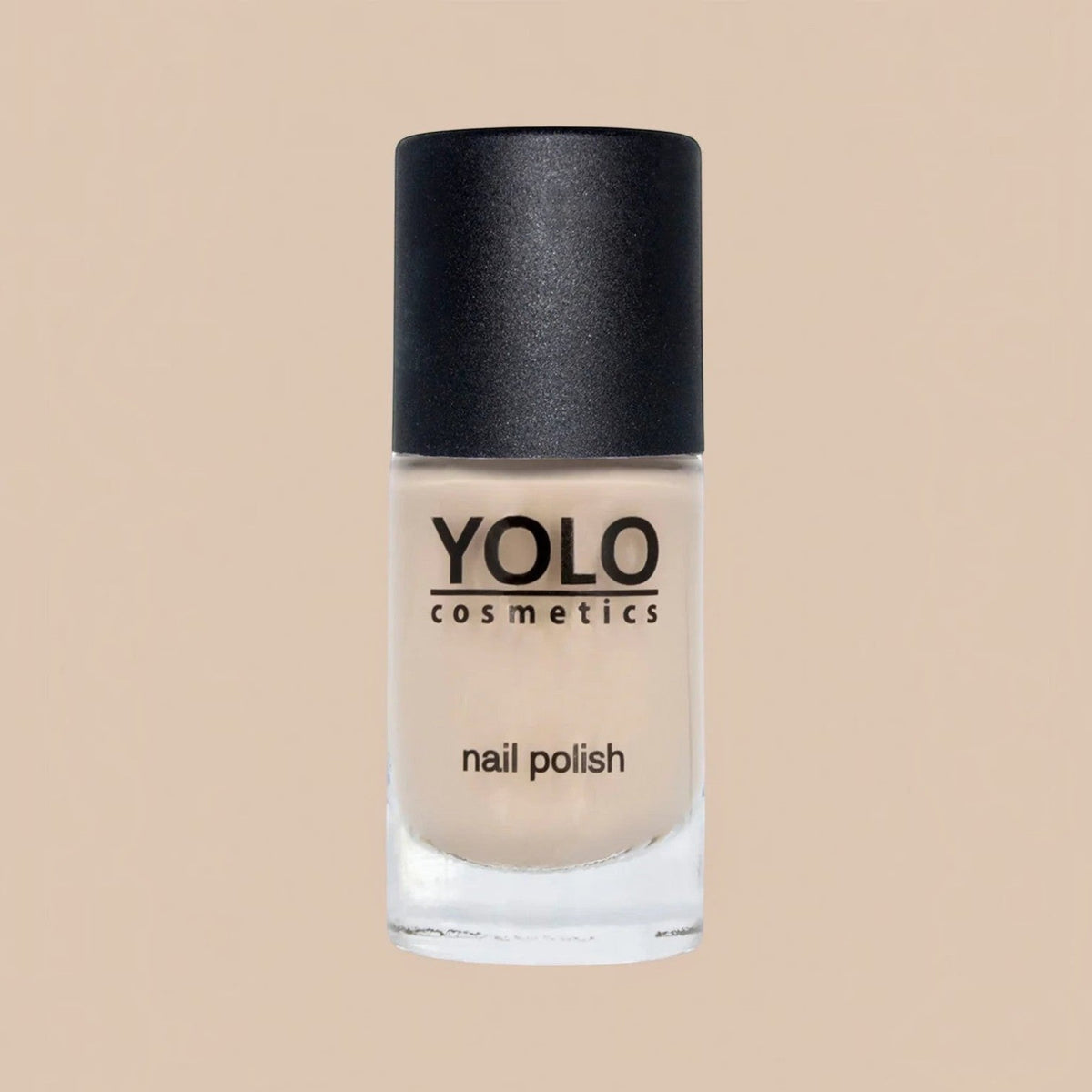 Said Salem YOLO Beige nail polish in a clear glass bottle with a black cap, featuring a neutral creamy beige shade.