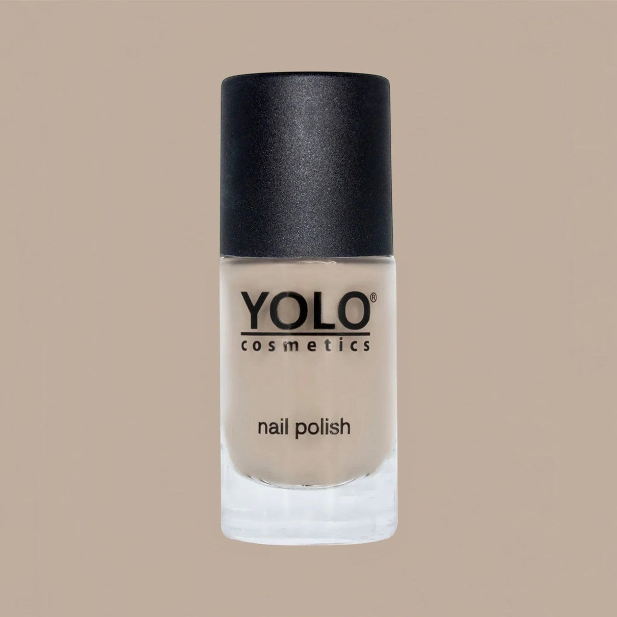 Said Salem YOLO Beige nail polish in a glass bottle with a black cap, featuring a neutral, creamy beige lacquer.
