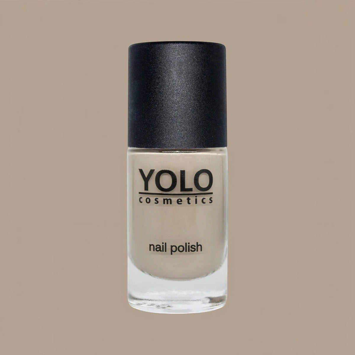 Said Salem YOLO Beige nail polish in a clear glass bottle with a black cap, featuring a neutral, creamy beige shade.