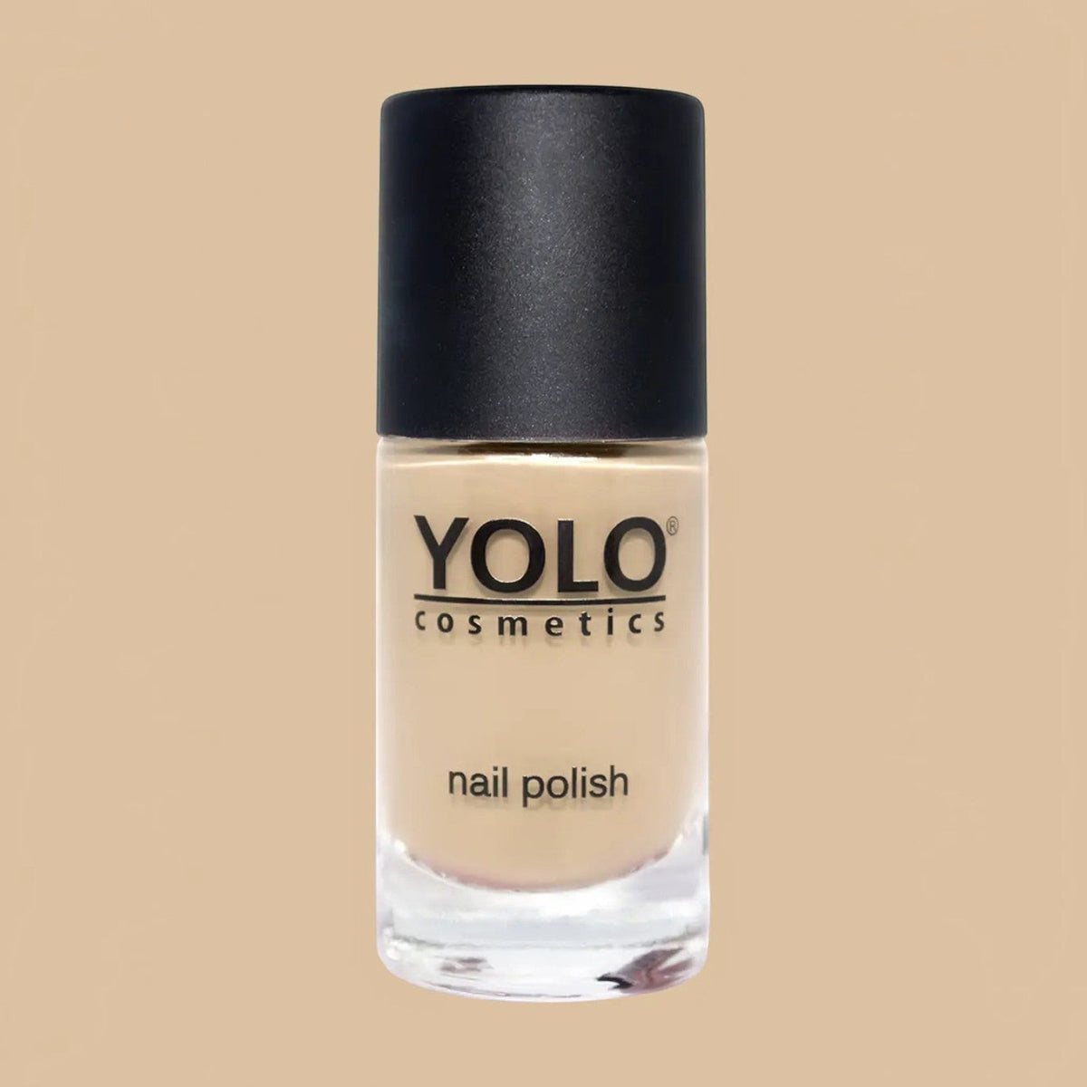 Said Salem YOLO Beige nail polish in a clear glass bottle with a black cap, featuring a neutral creamy beige shade.