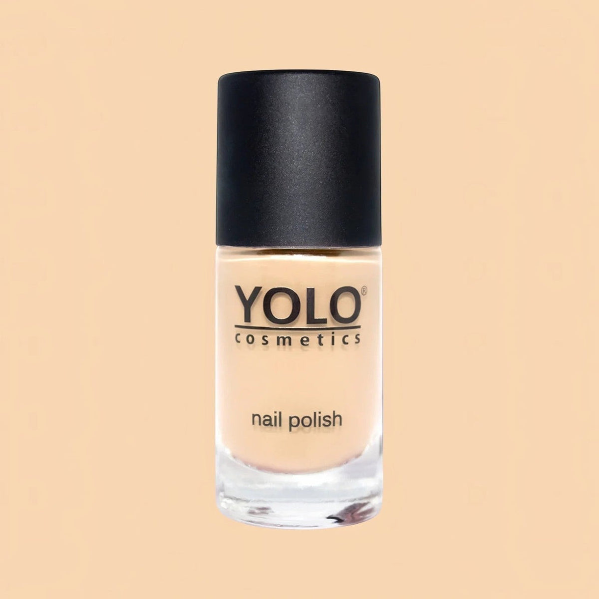 Said Salem YOLO Beige nail polish in a glass bottle with a black cap, featuring a neutral, creamy beige lacquer.