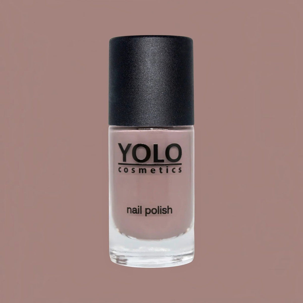 Said Salem YOLO Beige nail polish in a glass bottle with a black cap, featuring a neutral, creamy beige lacquer.
