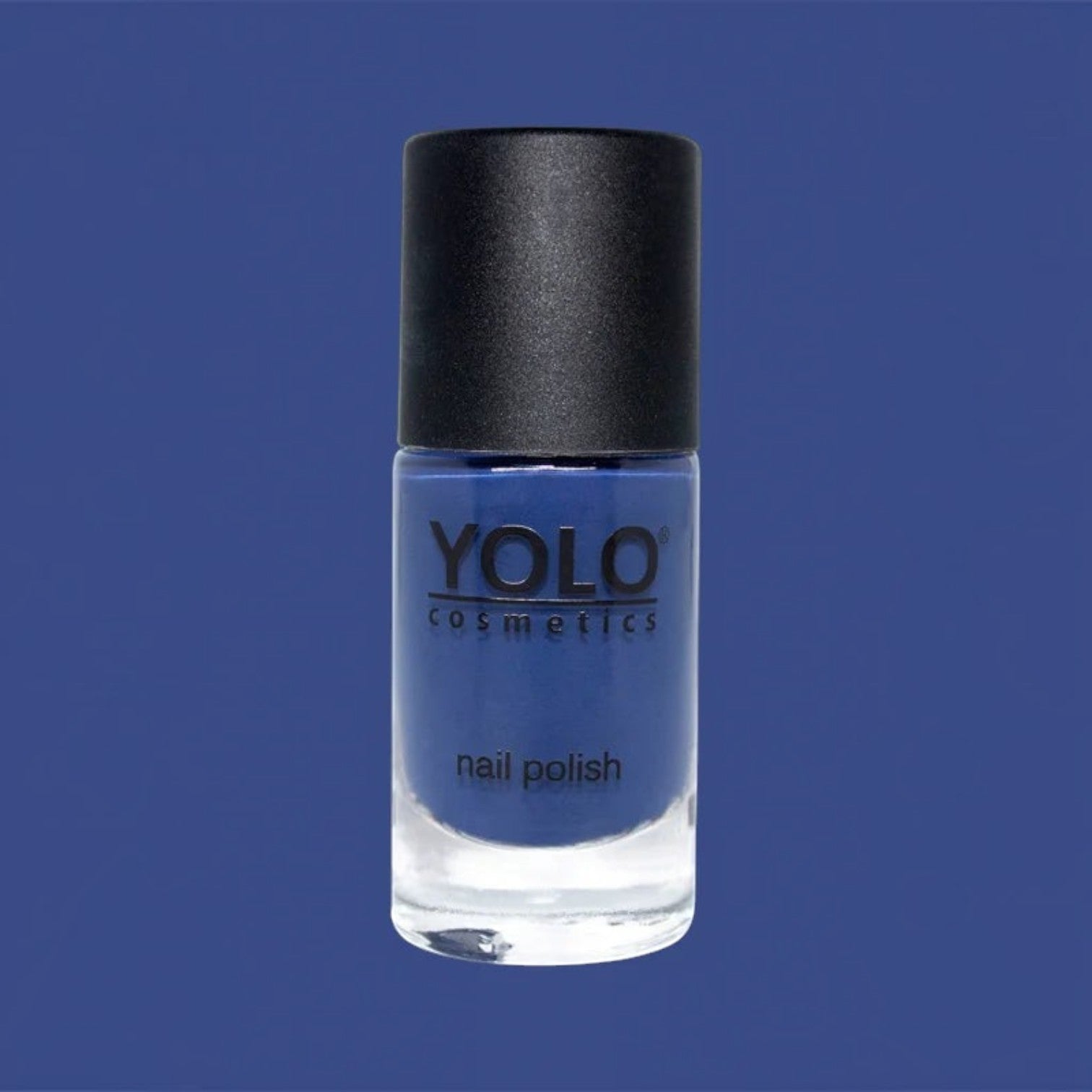 Said Salem YOLO Blue nail polish in a deep navy crème finish with a black cap against a matching blue background.