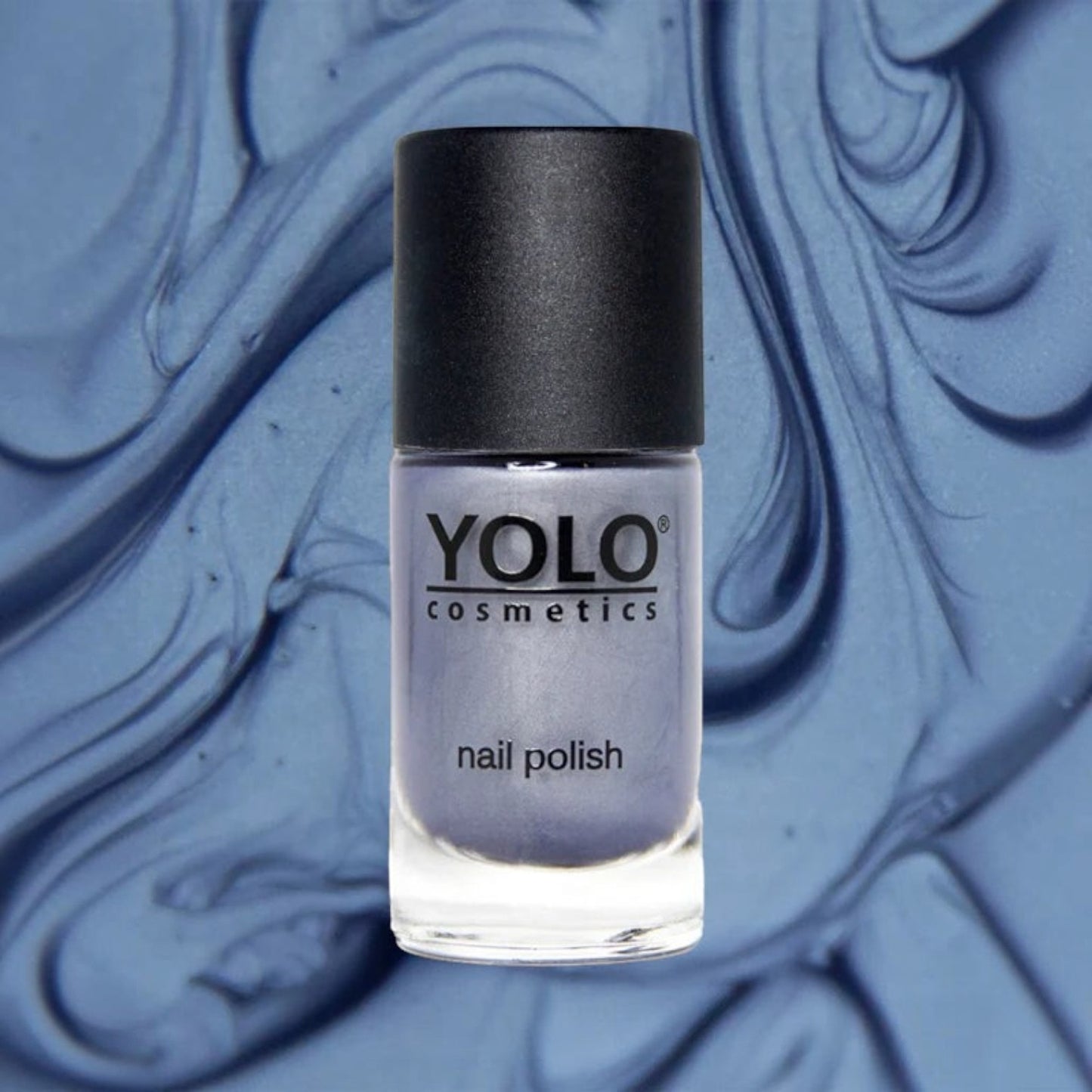 Said Salem YOLO Blue shimmer nail polish in a glass bottle with a black cap against a swirled blue background.