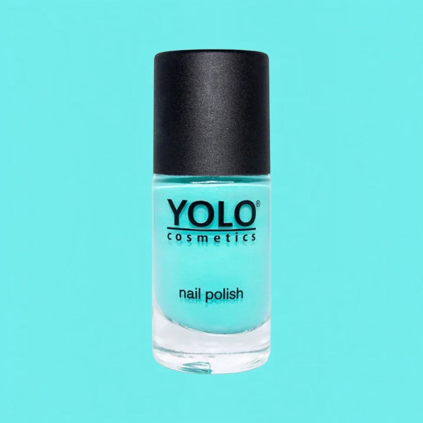 Said Salem YOLO Blue electric teal nail polish in a glass bottle with a black cap against a matching blue background.