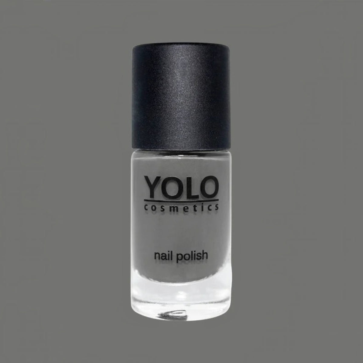 Said Salem YOLO Gray nail polish in a sleek glass bottle with a matte black cap, featuring a neutral charcoal tone.