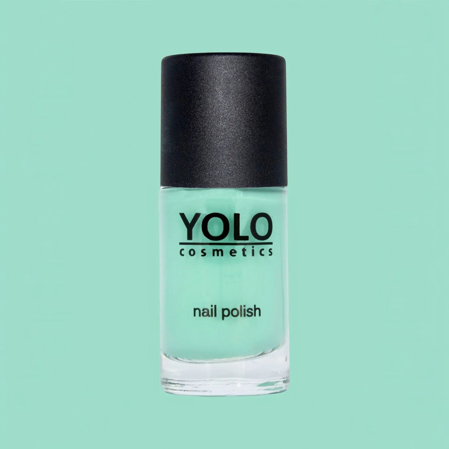 Said Salem YOLO Green mint pastel nail polish in a glass bottle with a black cap against a matching green background.
