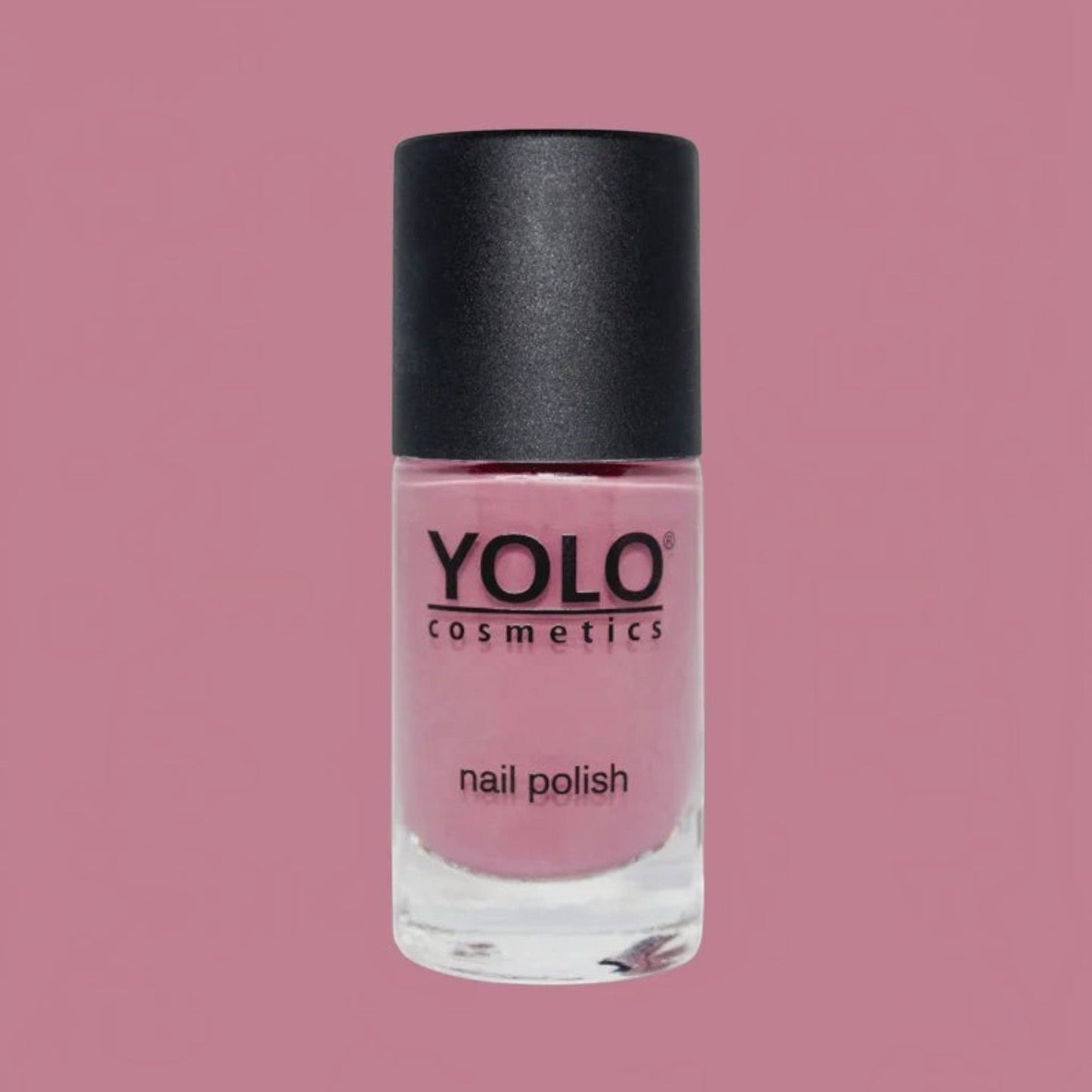 Said Salem YOLO Pink nail polish bottle in a soft mauve shade with a black cap against a matching pink background