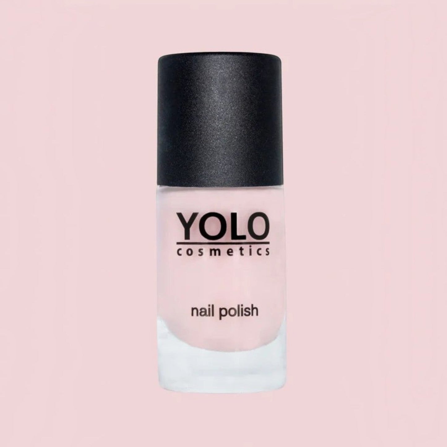 Said Salem YOLO Pink nail polish in a soft pastel shade with a black cap, presented in a clear glass bottle.