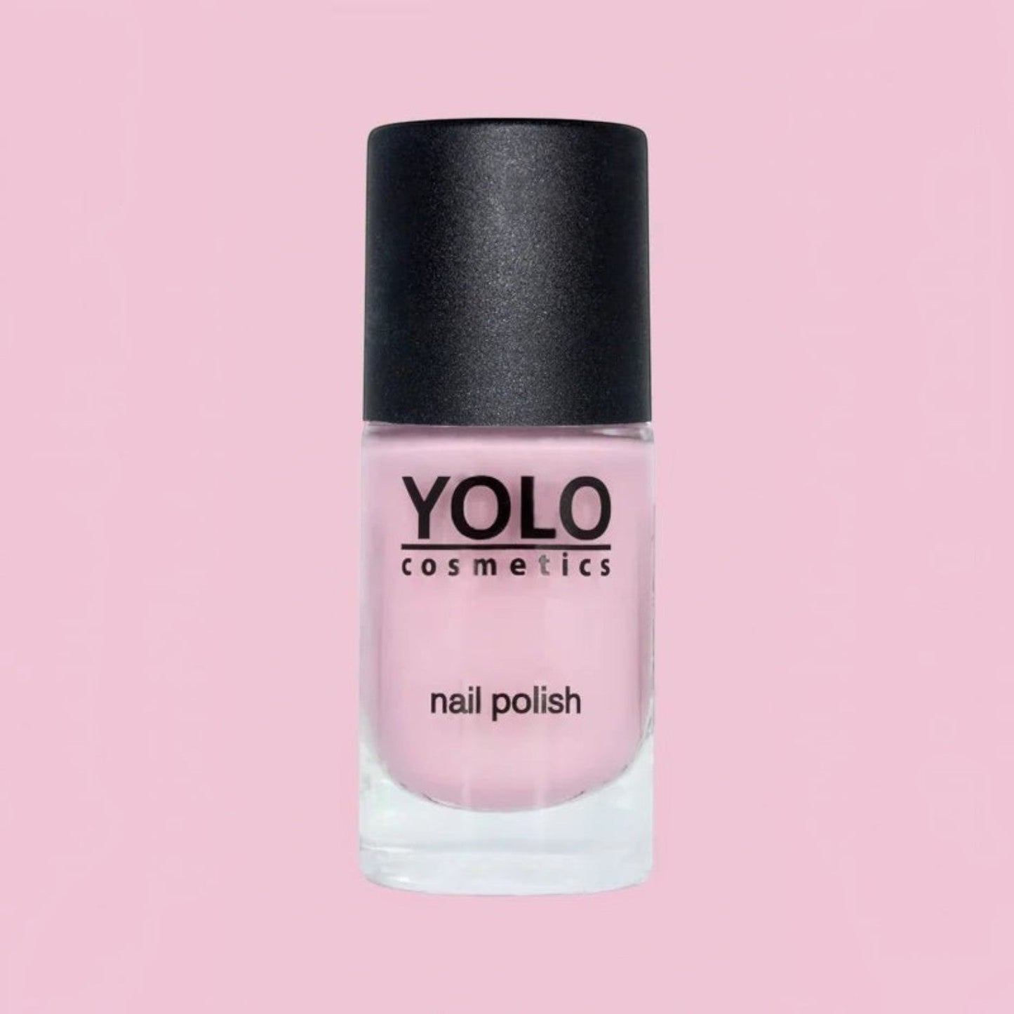 Said Salem YOLO Pink nail polish in a soft pastel shade with a black cap, presented in a clear glass bottle.