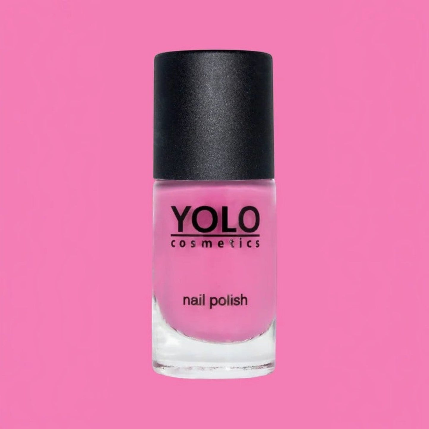 Said Salem YOLO Pink nail polish bottle with a vibrant fuchsia shade and a sleek black cap against a pink background.