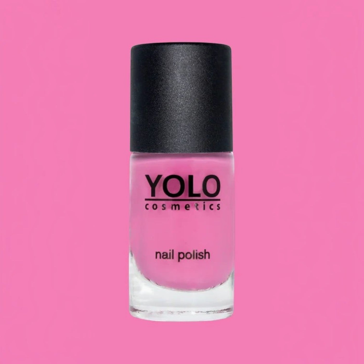 Said Salem YOLO Pink nail polish bottle with a vibrant fuchsia shade and a sleek black cap against a pink background.