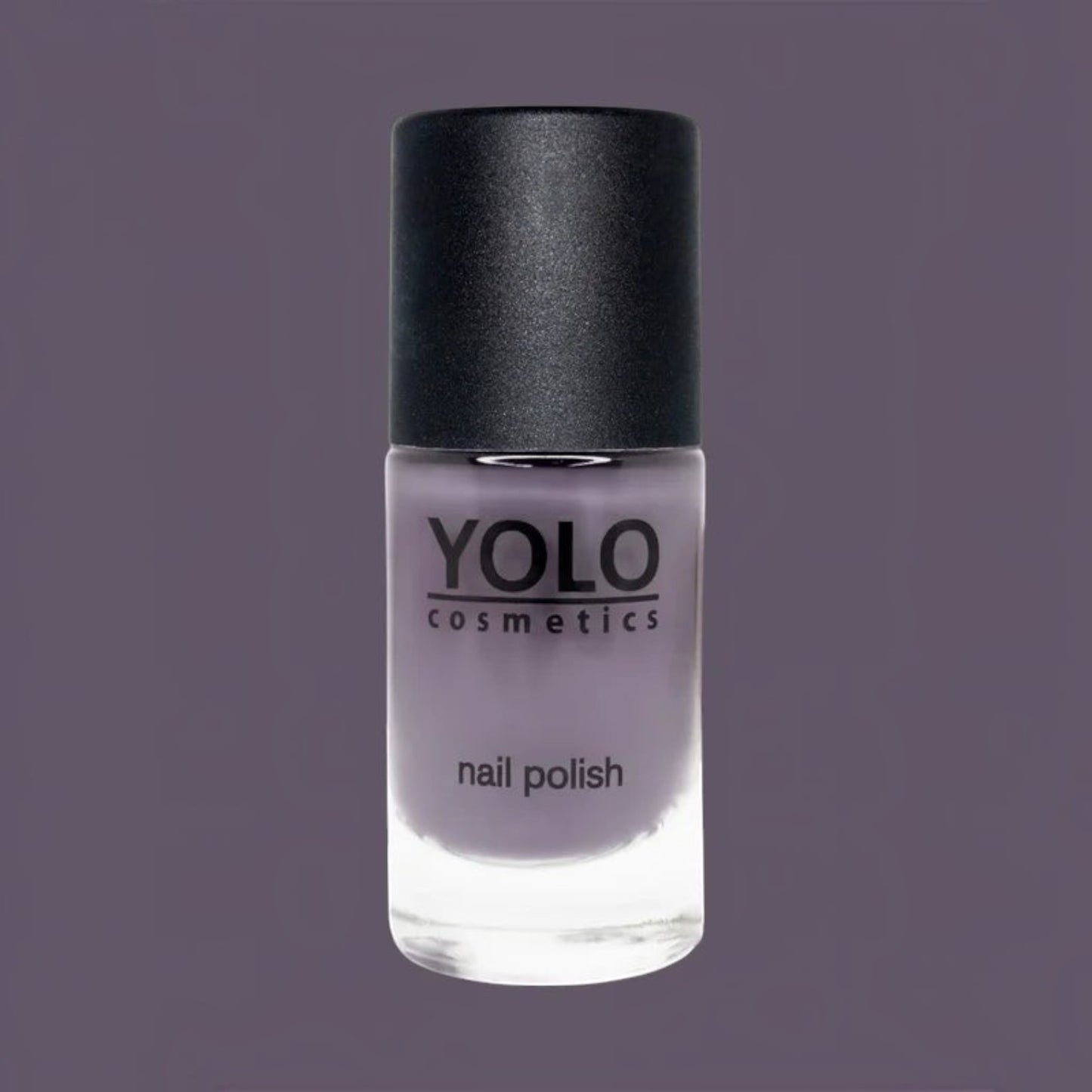 Said Salem YOLO Purple nail polish in a glass bottle with a black cap against a matching purple background.