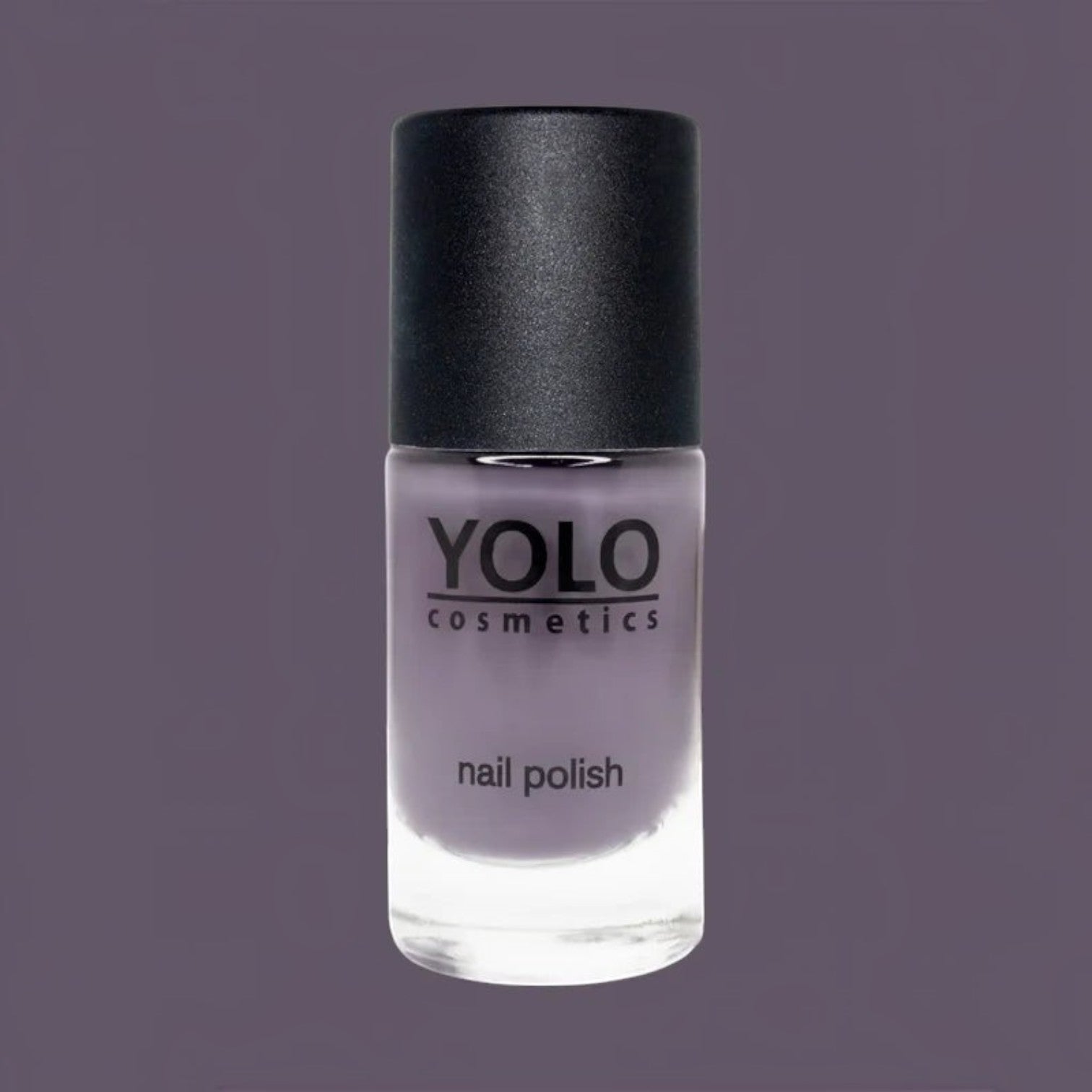 Said Salem YOLO Purple nail polish in a glass bottle with a black cap against a matching purple background.