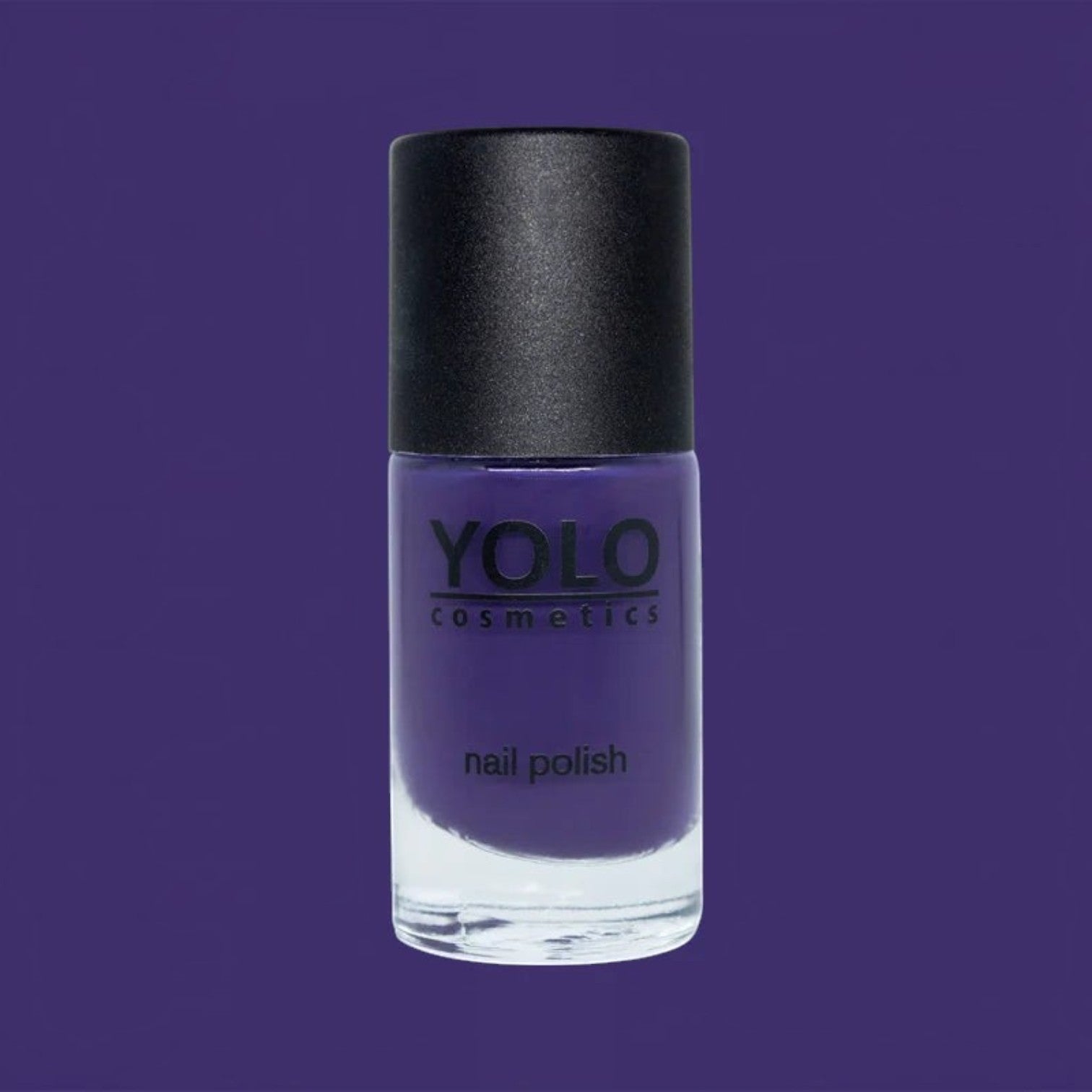 Said Salem YOLO Purple nail polish in a clear glass bottle with a black cap against a matching purple background.