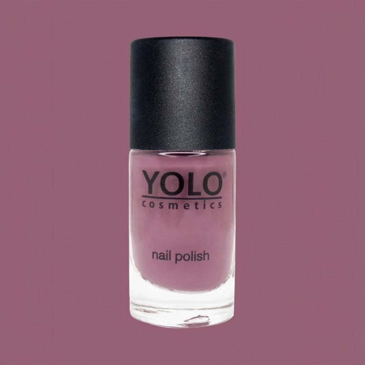 Said Salem YOLO Purple nail polish in a glass bottle with a black cap against a matching mauve background