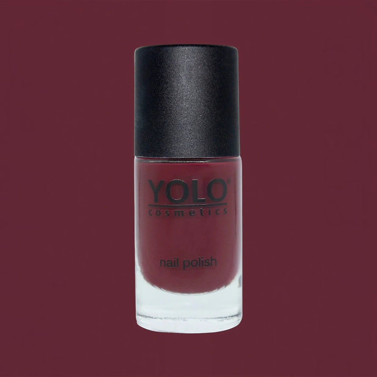 Said Salem YOLO Red nail polish in a sleek glass bottle with a high-shine, deep red, chip-resistant formula.