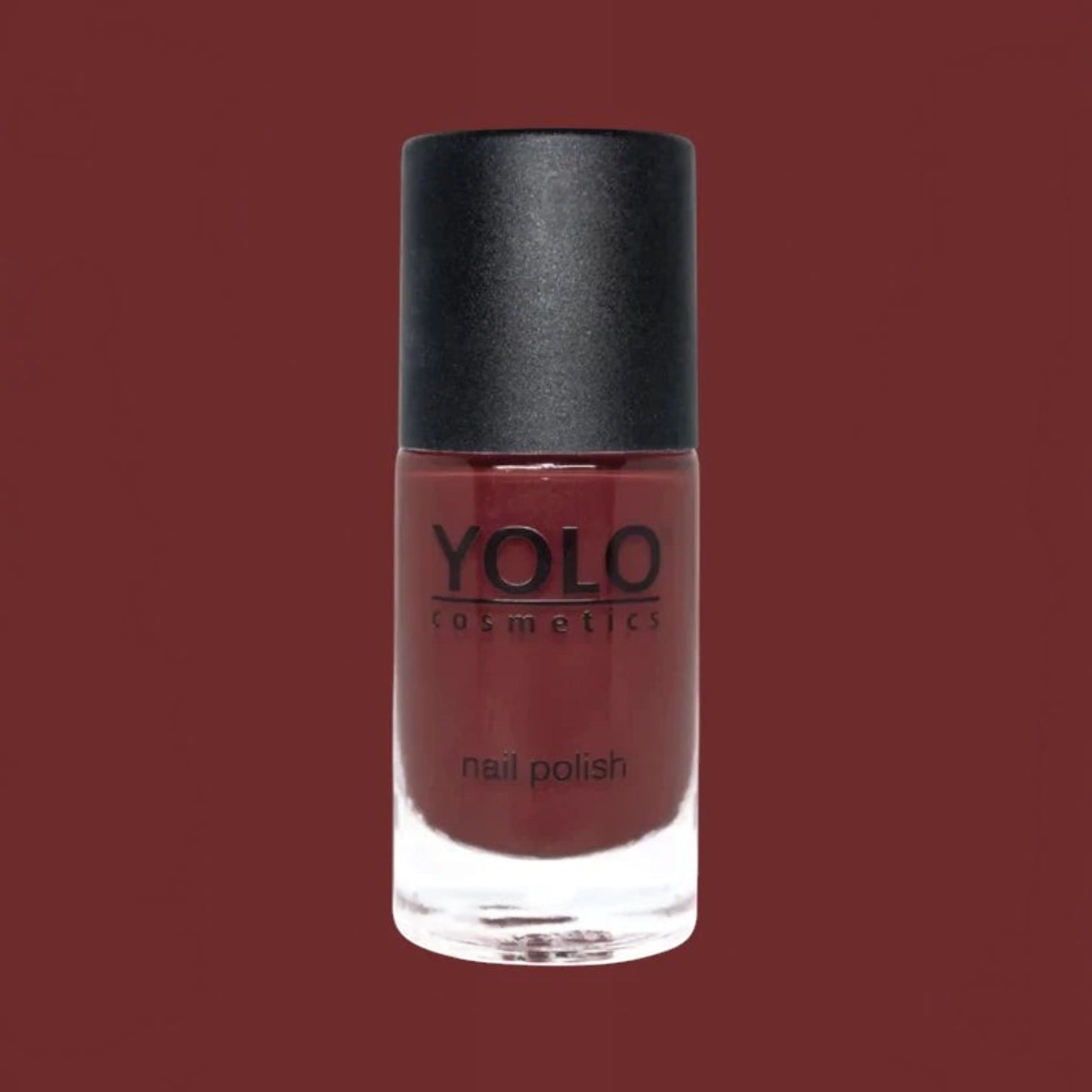Said Salem YOLO Red nail polish in a sleek glass bottle with a matte black cap, featuring a deep, vibrant red shade.