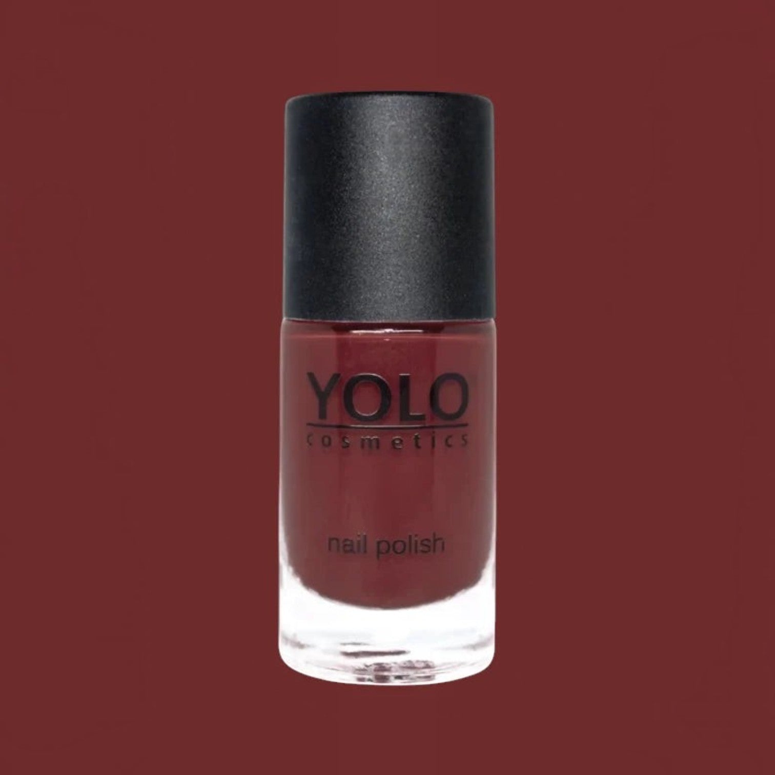 Said Salem YOLO Red nail polish in a sleek glass bottle with a matte black cap, featuring a deep, vibrant red shade.