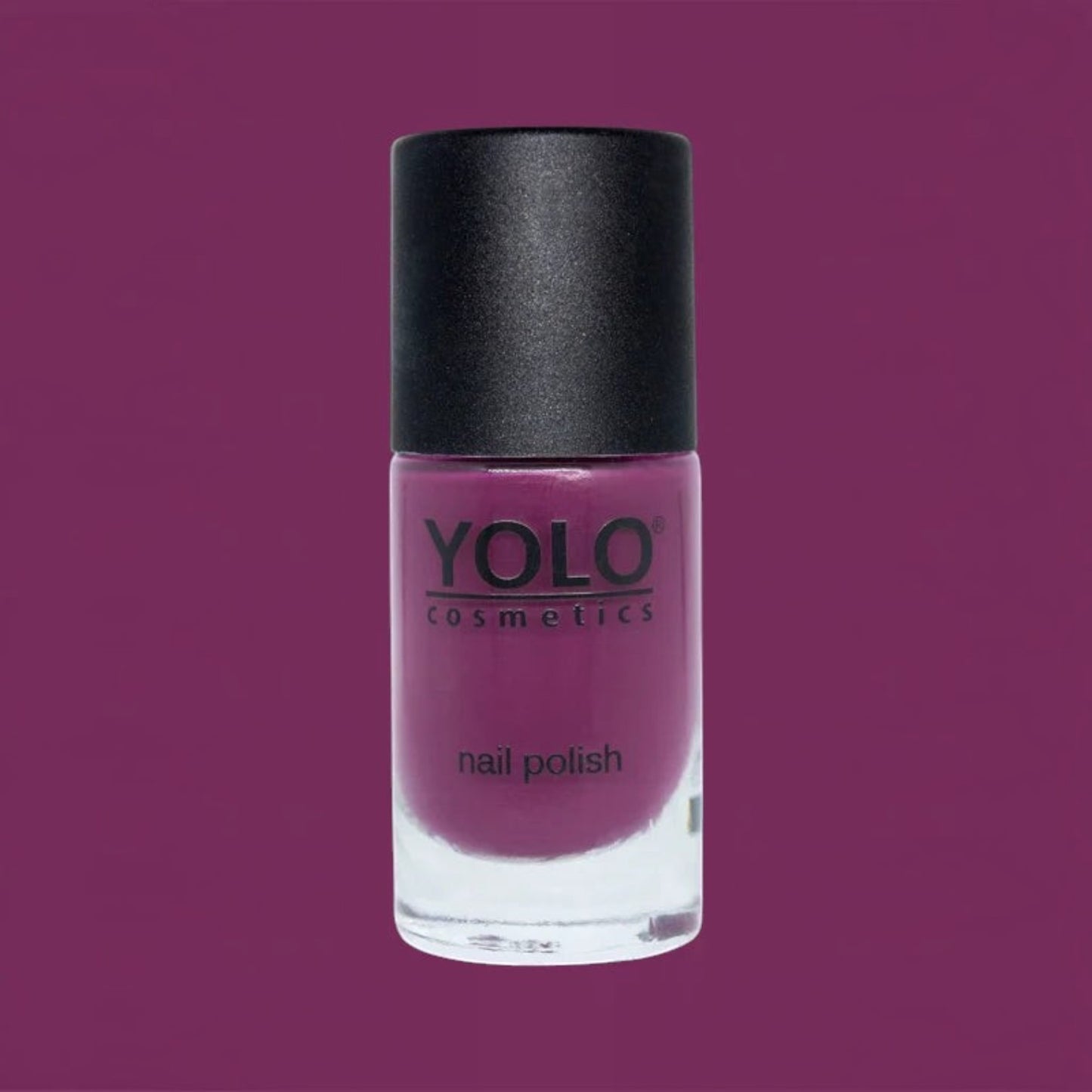 Said Salem YOLO Red nail polish in a sleek glass bottle with a black cap, featuring a vibrant deep red pigment.