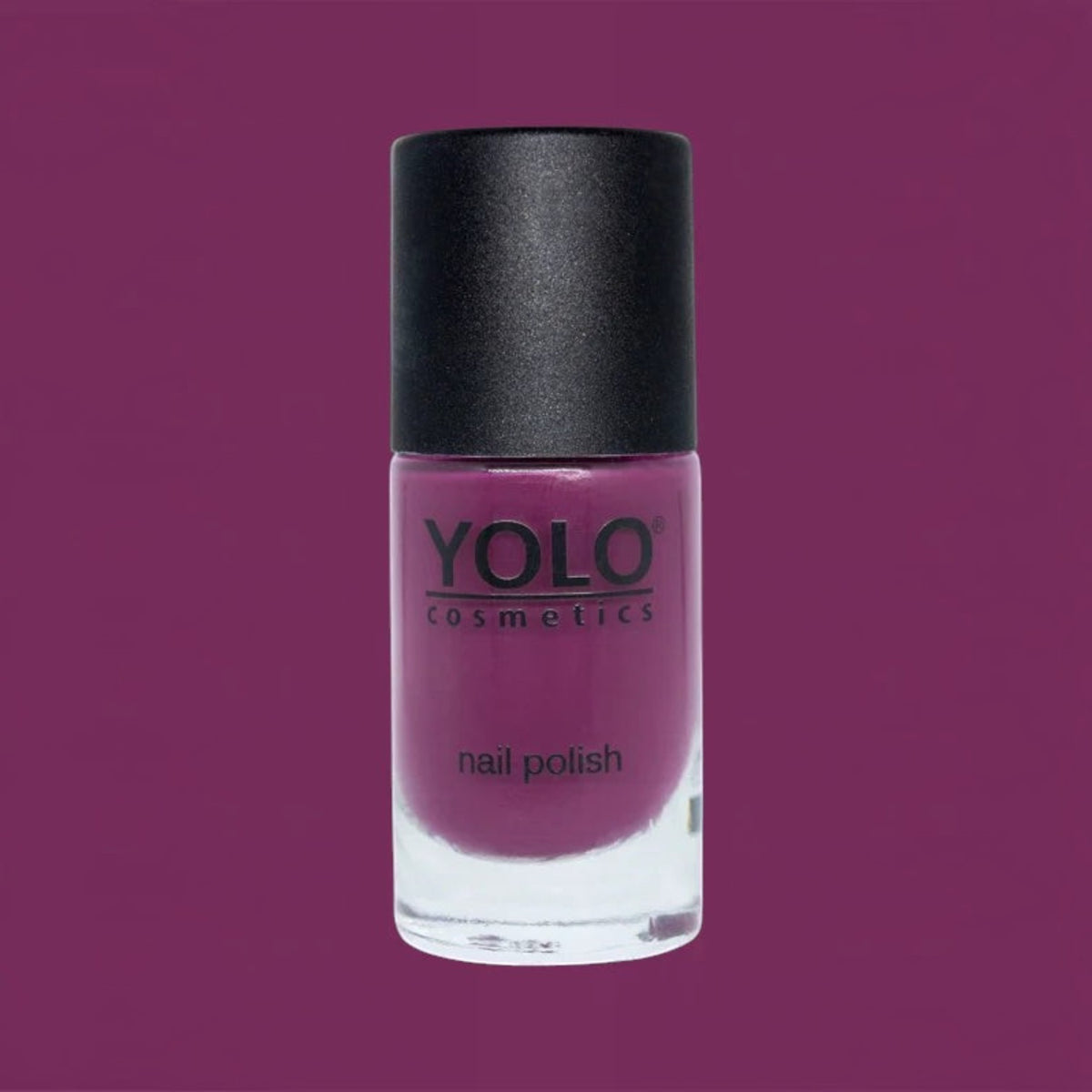 Said Salem YOLO Red nail polish in a sleek glass bottle with a black cap, featuring a vibrant deep red pigment.