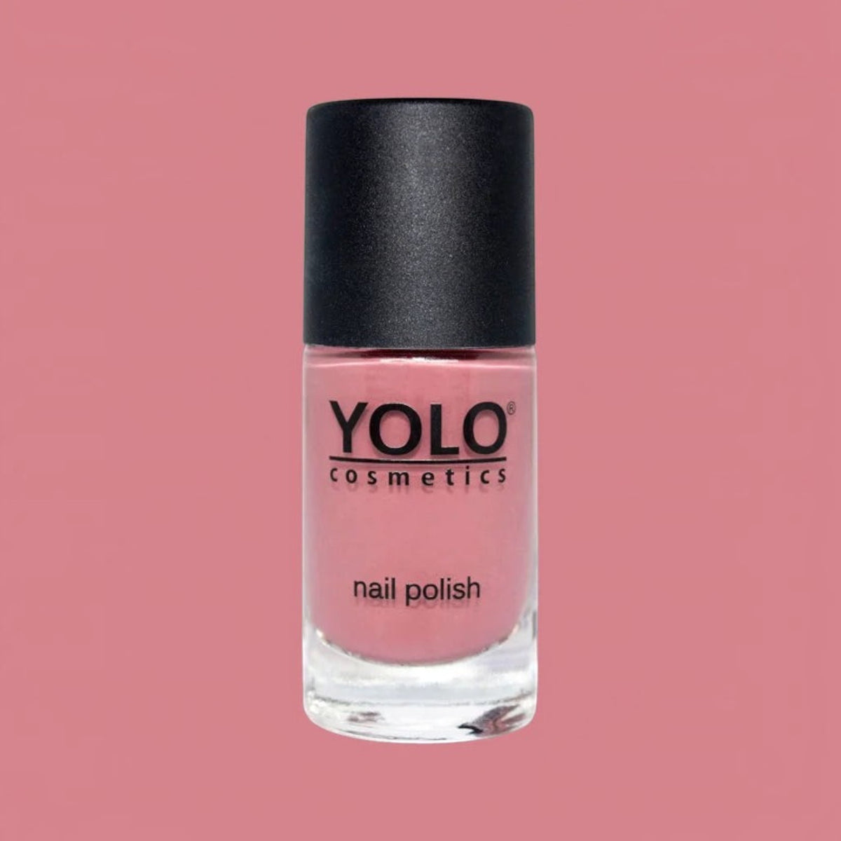 Said Salem YOLO Red nail polish in a sleek glass bottle with a black cap, featuring a vibrant, high-shine red finish.