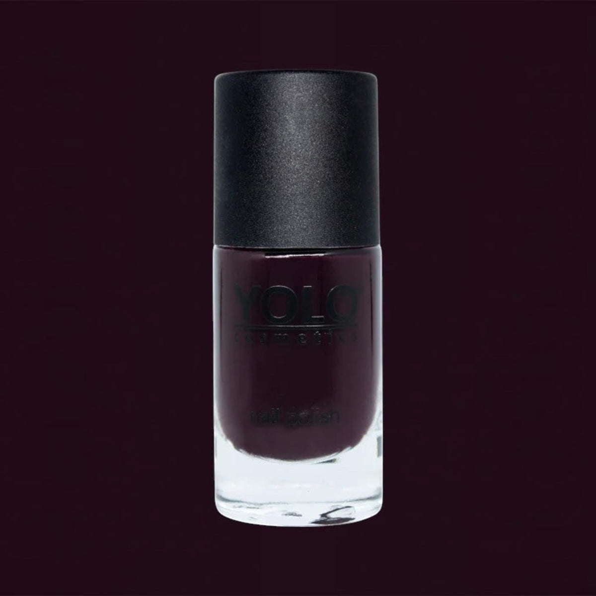 Said Salem YOLO Red nail polish in a deep, high-shine dark red shade with a sleek glass bottle and black cap.