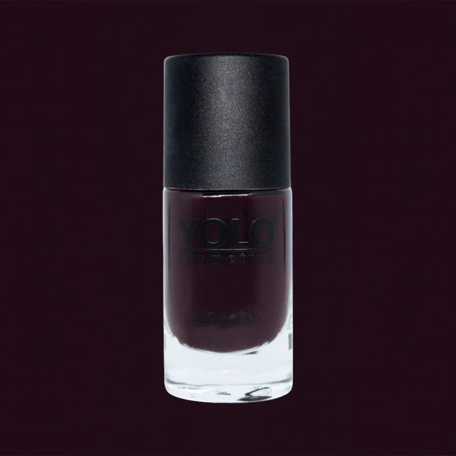 Said Salem YOLO Red nail polish in a deep, high-shine dark red shade with a sleek glass bottle and black cap.