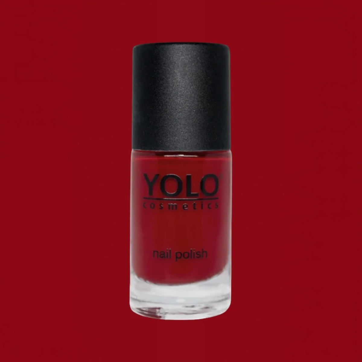 Said Salem YOLO Red nail polish in a sleek glass bottle with a black cap, featuring a vibrant high-shine red finish.