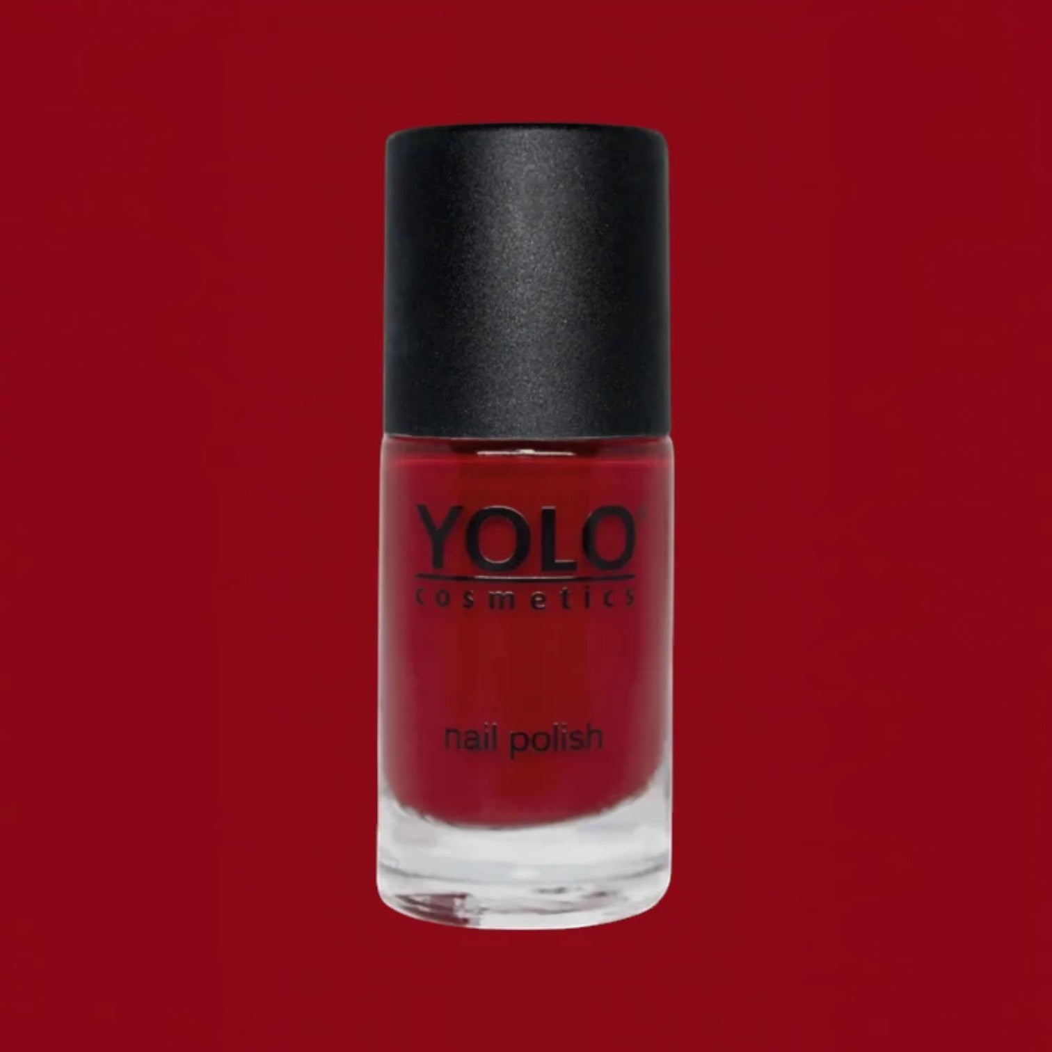 Said Salem YOLO Red nail polish in a sleek glass bottle with a black cap, featuring a vibrant high-shine red finish.