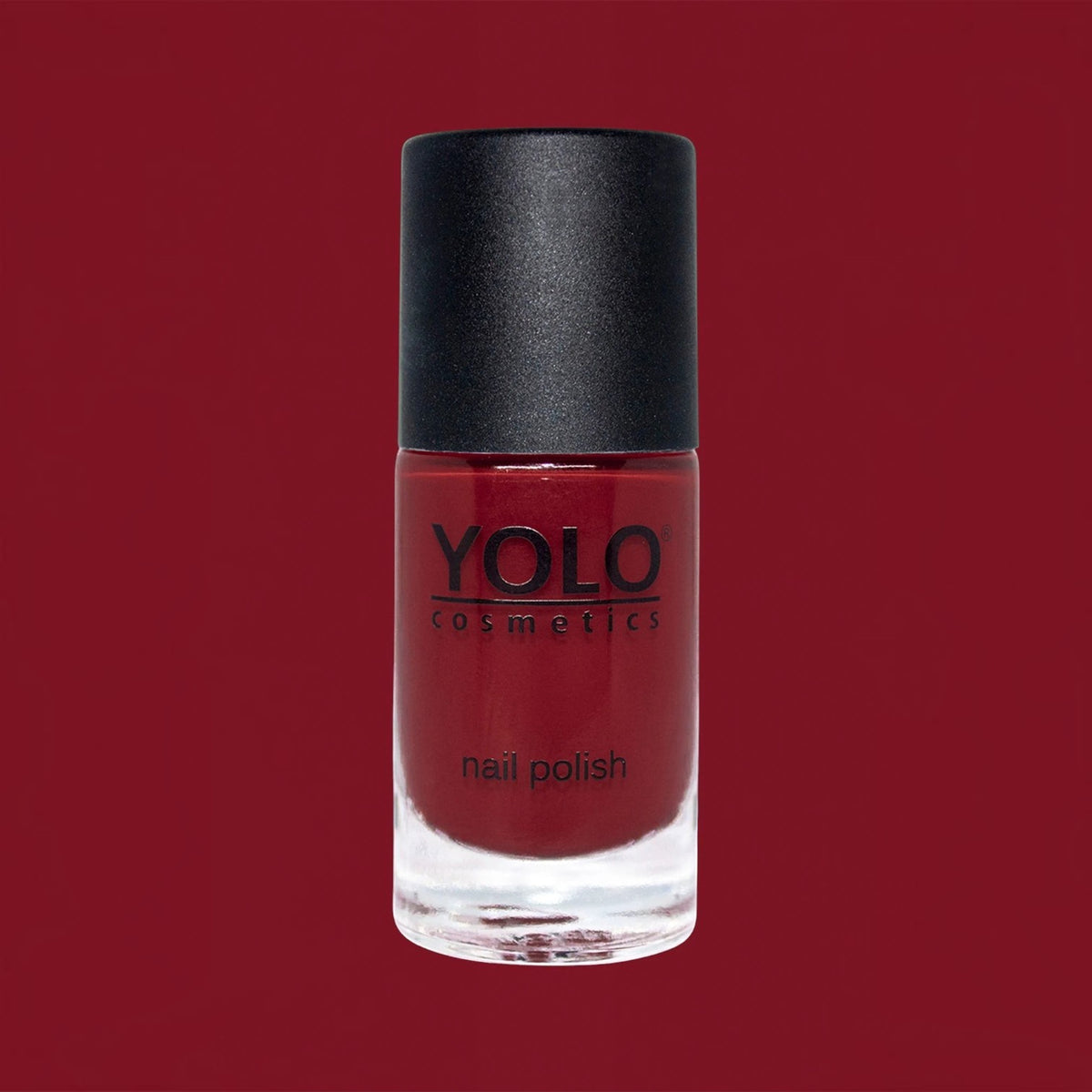Said Salem YOLO Red nail polish in a sleek glass bottle with a black cap, featuring a vibrant high-pigment finish.