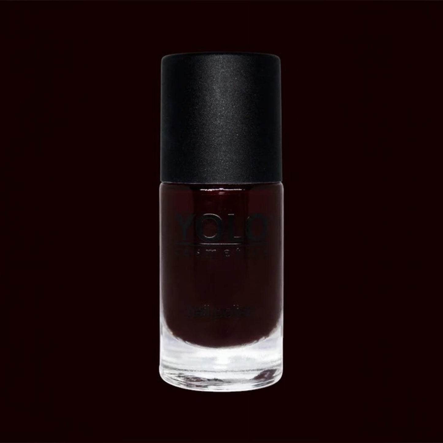 Said Salem YOLO Red nail polish in a sleek glass bottle with a matte black cap, featuring a deep, high-shine finish.