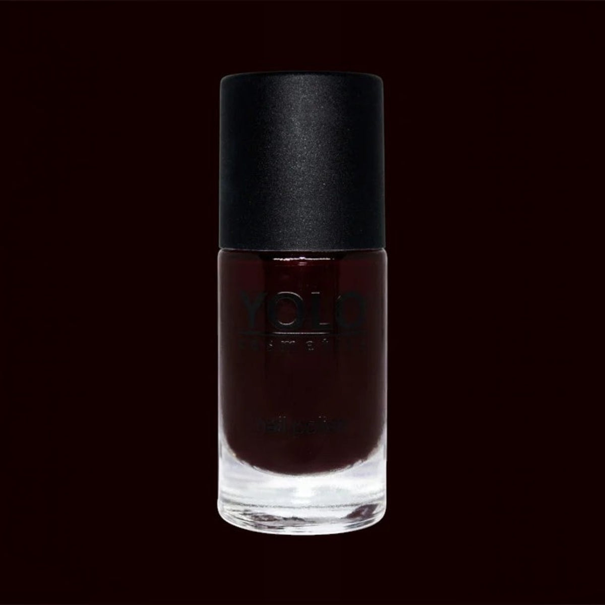 Said Salem YOLO Red nail polish in a sleek glass bottle with a matte black cap, featuring a deep, high-shine finish.